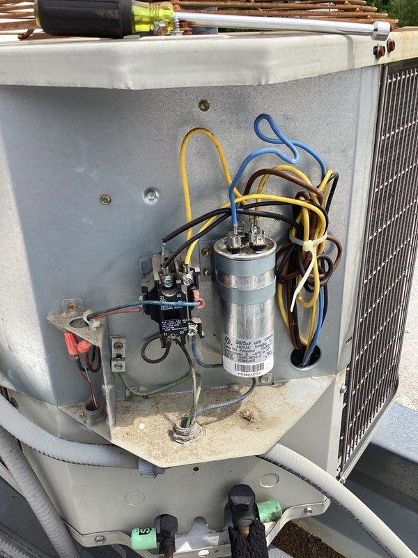 Completed scheduled AC maintenance and tune-up on rooftop R-22 system. Inspected filter which had been recently changed and found in acceptable condition. Performed diagnostic testing using manifold gauges and amp meter, revealing slightly low refrigerant pressures indicating possible undercharge. Observed multiple supply vents intentionally blocked with styrofoam sheets, which may be contributing to abnormal pressure readings and affecting system performance. Unit currently operating with 16-degree temperature split. Inspected electrical components including capacitor and contactor, both found in functional condition. System operational at conclusion of service visit, though low refrigerant charge may require attention in future.