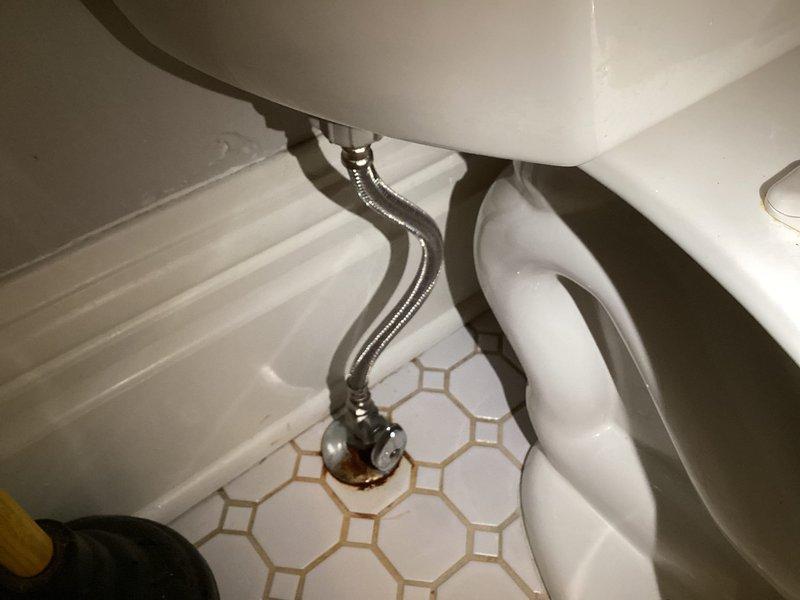 Responded to toilet malfunction where unit would not stop running and required manual shutoff at the supply valve. Upon inspection, identified failed fill valve causing continuous water flow and improper tank filling. Tank interior showed significant mineral deposits and staining consistent with age and hard water exposure. Replaced defective fill valve assembly with new unit and installed new flapper valve to ensure proper seal and flush operation. Tested system functionality to verify proper fill cycle, shutoff operation, and complete flush performance. Toilet now operates correctly with no continuous running.