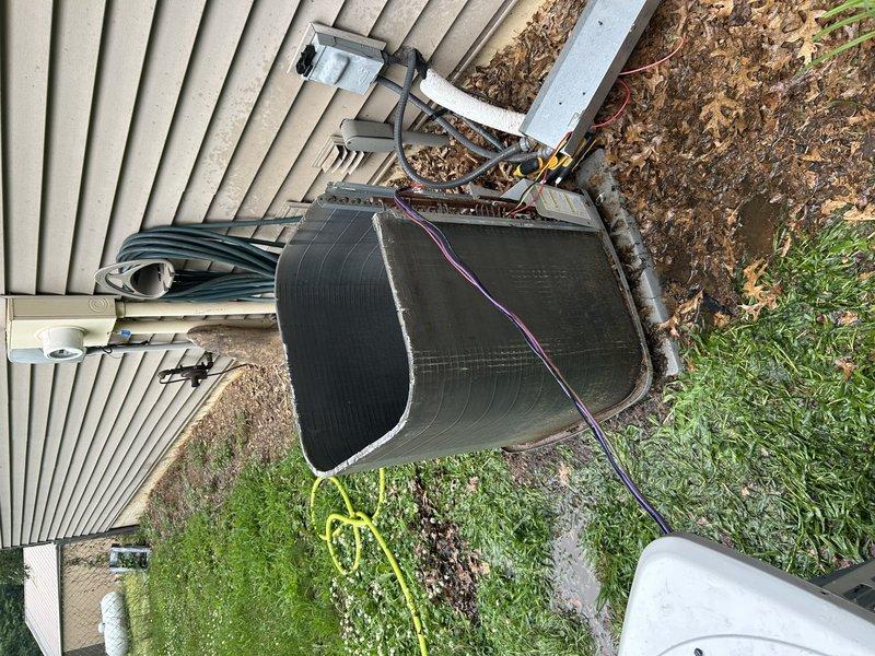 Responded to no-cool call on south-side AC unit of dual-system residence (10+ years old) with reported breaker tripping issues. Upon inspection, identified pinched compressor wire and completely failed capacitor. Repaired pinched wiring, replaced capacitor, and performed coil wash on outdoor unit. System startup and performance testing revealed adequate cooling with good temperature drop in conditioned space, though subcooling measured at 2° indicating potential minor refrigerant undercharge. System currently operating within acceptable parameters; recommended monitoring performance and reassessing refrigerant charge if cooling capacity diminishes.