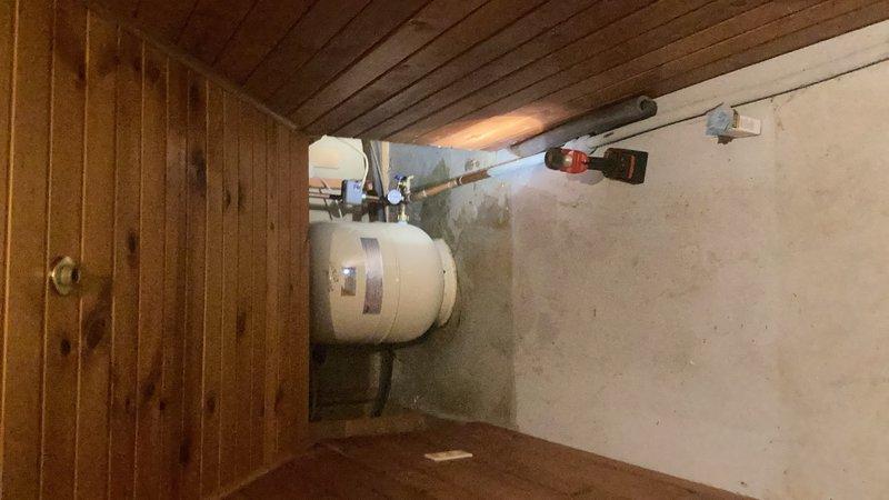 Responded to service call for leaking well pressure tank and pressure gauge in basement utility area. Upon inspection, confirmed active leak at pressure gauge connection on 12-5 gallon well pressure tank. Replaced faulty pressure gauge with new unit, ensuring proper seal and thread connection. Discussed potential relocation options for pressure tank system with customer for future consideration.