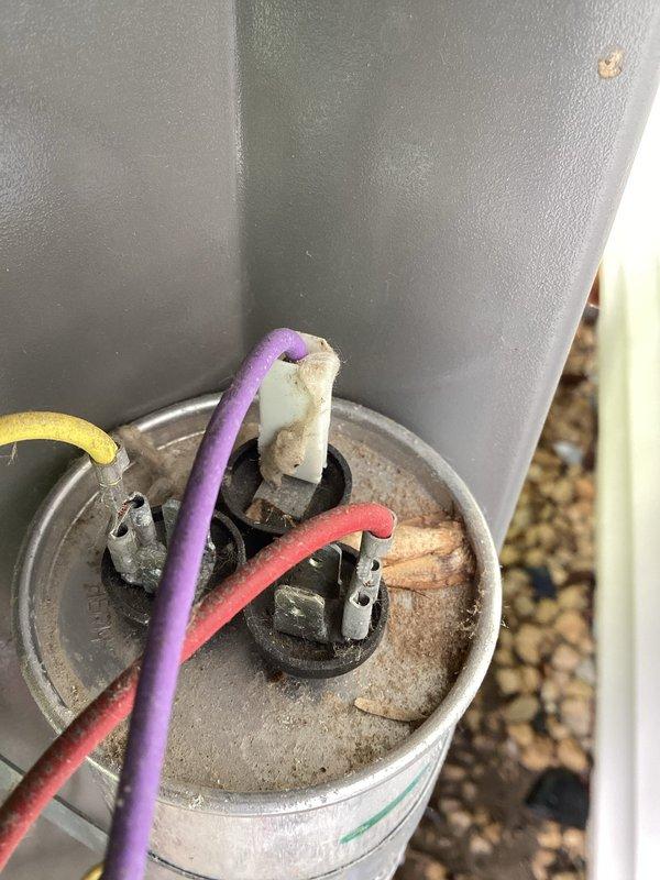 Completed seasonal AC tune-up on a 9-year-old Lennox system that was operating properly upon arrival. Performed standard maintenance protocol including electrical testing at the outdoor unit using digital multimeter to verify proper voltage and amperage readings. Inspected exterior electrical connections and terminal blocks, noting weathered housing with minor surface corrosion but secure wire terminations. System tested and confirmed to be functioning within normal parameters with no deficiencies requiring immediate attention.