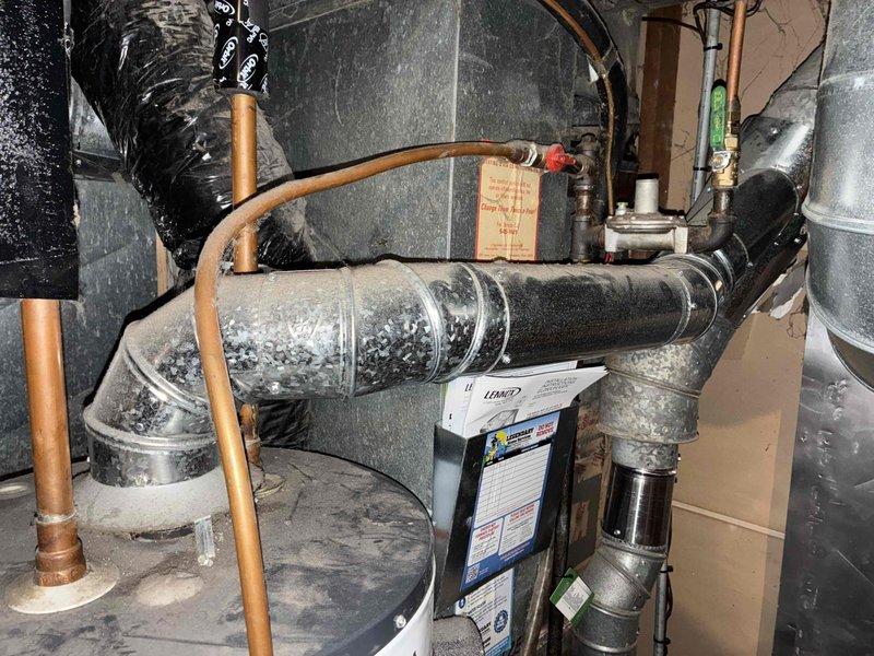 Responded to no hot water complaint on tanked water heater. Upon arrival, confirmed pilot light was extinguished and unit was not producing hot water. Diagnosed tripped high limit safety switch, indicating overheating condition had occurred. Reset high limit control and successfully relit pilot light. Verified proper burner operation and flame characteristics. Tested hot water output to confirm system restoration. Unit returned to normal operation with adequate hot water production.