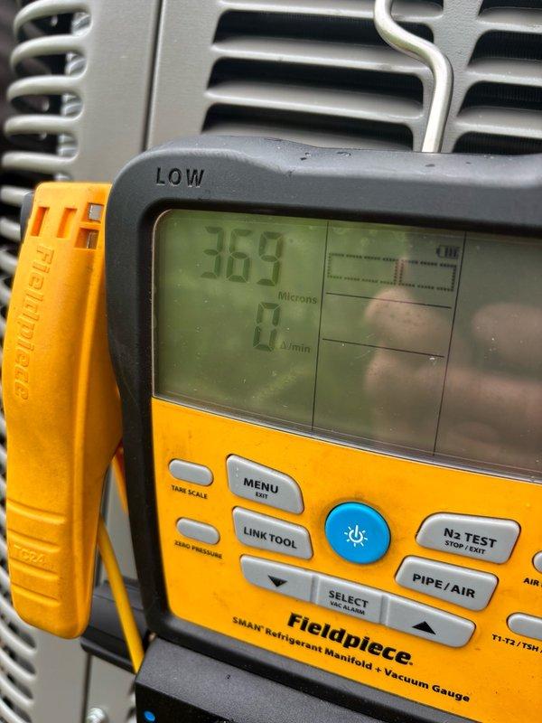 Responded to performance complaint regarding air conditioning system not maintaining adequate cooling capacity. Upgraded system from 2-ton R-410A unit to 2.5-ton R-454B unit to address undersized equipment issue. Replaced outdoor condensing unit model ML13KC1-030, installed new indoor evaporator coil model CK40CT-30B-71, and added RDS sensor for enhanced system monitoring. Performed vacuum and refrigerant charging procedures, verified proper system operation and micron levels using calibrated manifold gauges.