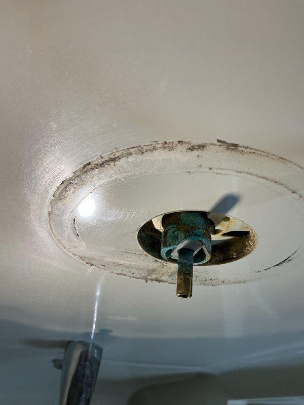 Responded to a dripping shower valve in the master bathroom where the homeowner had unsuccessfully attempted to resolve the issue by replacing the handle. Upon inspection, diagnosed a failed Moen cartridge within the valve body and noted significant verdigris corrosion on the valve assembly indicating advanced oxidation of the brass components. Presented options to either replace the entire valve assembly due to the deteriorating condition or proceed with cartridge replacement as a temporary solution. Per customer decision, removed the defective cartridge, installed a replacement Moen cartridge, and performed leak testing to verify proper operation and confirm the drip had been eliminated.