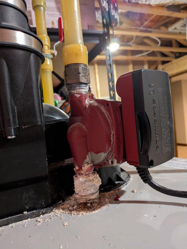 Responded to a water heater recirculation pump leak on a Hydropro tanked water heater system. Upon inspection, discovered extensive corrosion and mineral deposits around the pump connections and mounting base, indicating a prolonged slow leak that had compromised the unit's integrity. Assessed the circulation pump assembly and associated piping connections, documented the corrosion damage with photographs, and ordered the appropriate replacement recirculation pump to restore proper system operation and eliminate the leak.