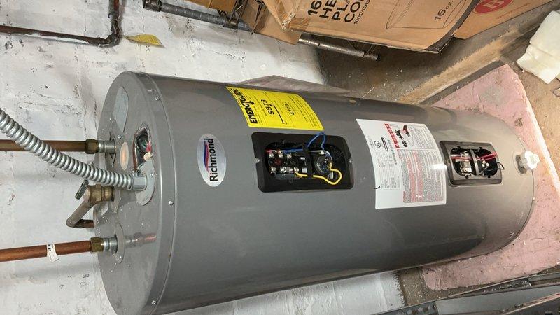 Responded to service call for electric water heater with no hot water production. Upon inspection, diagnosed failed thermostats as the root cause of system failure. Presented multiple repair options to customer, who elected to proceed with complete water heater replacement. Successfully removed existing Richmond brand electric water heater and installed new Bradford White unit. Completed all necessary electrical connections, plumbing connections with copper piping, and verified proper operation of new system. Unit tested and left in full working order.