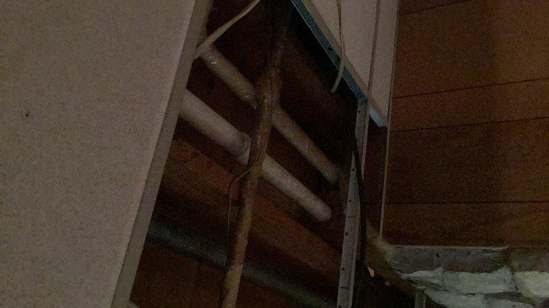 Responded to an active emergency water leak in the basement where water was pouring from a deteriorated galvanized kitchen drain pipe onto the walls and floor. Upon arrival, shut off the water supply to stop ongoing water damage. Identified the source as a rotted-out section of galvanized drain pipe. Cut out the compromised galvanized piping and replaced it with new materials to restore proper drainage function and eliminate the leak.
