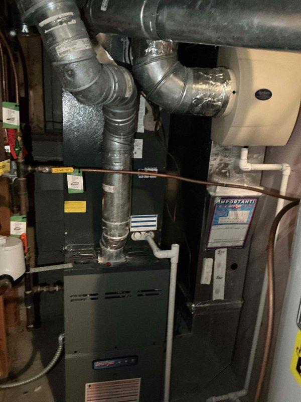 Completed comprehensive air conditioning tune-up on residential ComfortMaker cooling system as part of maintenance agreement. Performed standard seasonal inspection and servicing of outdoor condenser unit and indoor furnace components, including system performance verification and safety checks. Identified missing locking caps on refrigerant service ports and installed replacement locking caps to secure system against unauthorized access and environmental contamination.