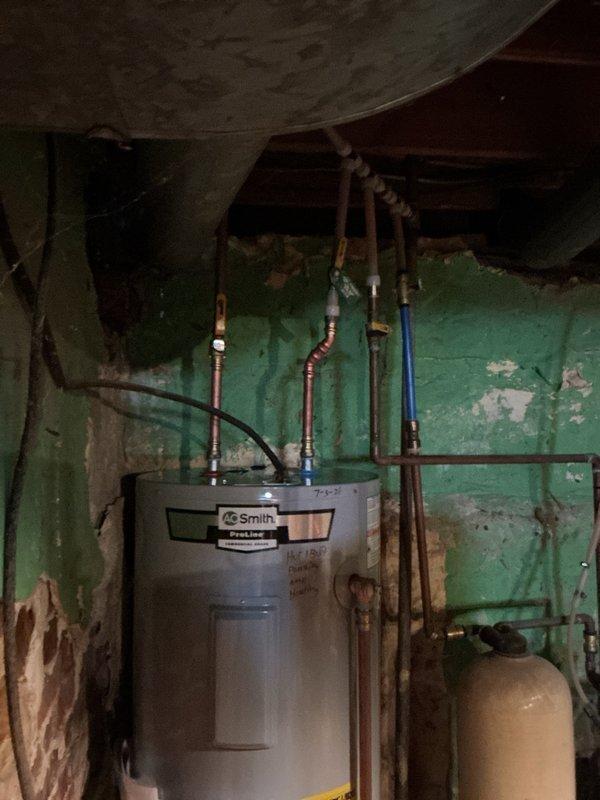 Responded to service call for leaking water heater. Upon arrival, diagnosed a 40-gallon electric A.O. Smith Proline water heater installed in 2021 experiencing active leakage from both heating element ports. Due to the nature and location of the leaks, determined that repair was not viable and complete replacement was necessary. Removed the failed unit and installed new 40-gallon electric water heater. Connected all copper supply lines, electrical connections, and plumbing fixtures. Verified proper operation of new unit and checked for leaks at all connection points. Removed old water heater from premises and left work area clean.