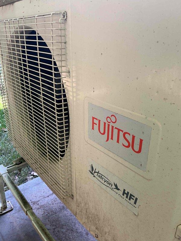 Responded to no cooling complaint on 10+ year old Fujitsu Halcyon mini split system. Upon arrival, performed diagnostic evaluation using manifold gauges to assess system pressures. Testing confirmed low refrigerant charge as the cause of inadequate cooling performance. Recharged system with refrigerant to restore proper operating levels and return unit to normal cooling operation.