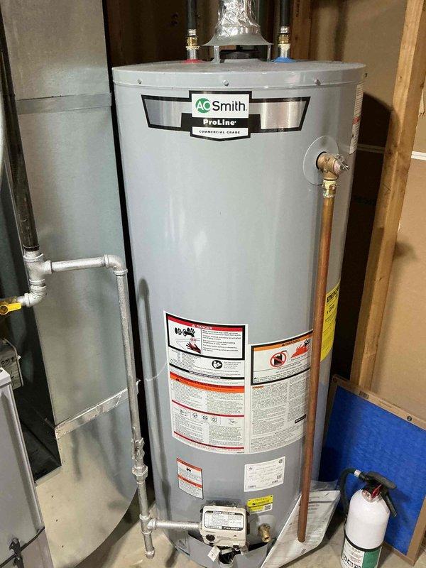 Completed comprehensive air conditioning tune-up and maintenance service as part of family rewards plan agreement. Cleaned routine components, flushed condensate drain line, and performed full system testing to verify proper operation. Documented equipment condition with photographs of AC unit and furnace for service records.