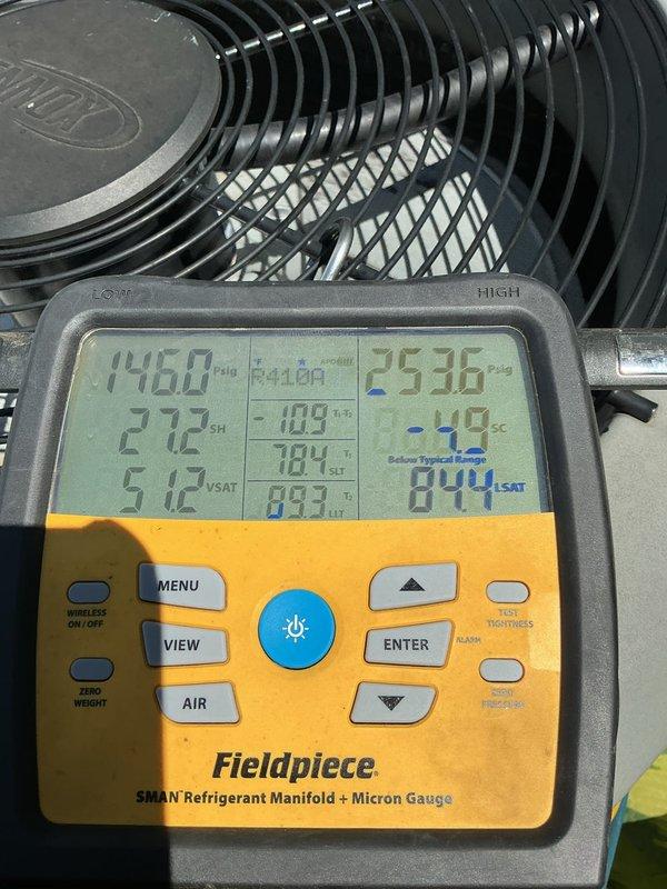 Responded to callback for system not cooling following thermostat replacement. Upon arrival, discovered previously installed T4 thermostat was incompatible with heat pump system. Replaced with compatible T6 thermostat to restore proper system communication and operation. Performed diagnostic testing using refrigerant manifold gauges, which revealed inefficient system performance due to faulty thermostatic expansion valve (TXV). Documented 2012 outdoor condensing unit condition with photos showing equipment age and installation. Replaced defective TXV to restore proper refrigerant metering and system efficiency. System now cooling properly with correct thermostat configuration and functioning expansion valve.