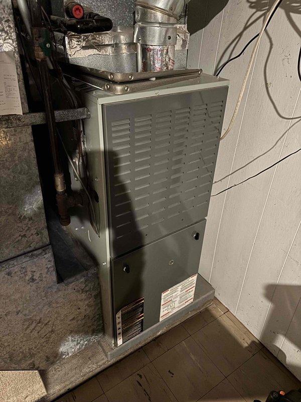 Completed annual preventative maintenance agreement visit for furnace and air conditioning system with no known issues reported. Performed comprehensive AC maintenance on one outdoor condenser unit utilizing R22 refrigerant with ambient temperature at 73 degrees. Inspection included air filter, thermostat operation, temperature split across evaporator coil, condenser unit, condenser and evaporator coils, blower motor, capacitors, compressor operation, refrigerant charge level, and condensate drain system. Air conditioning system tested and confirmed operating within normal parameters. Conducted full furnace maintenance inspection covering air filter condition, carbon monoxide levels, temperature rise, burner assembly, flame sensor, hot surface igniter, blower motor, run capacitor, condensate drain, and heat exchanger integrity. Heating system tested and verified operating normally with all safety controls functioning properly. Both HVAC systems are in good working condition and ready f