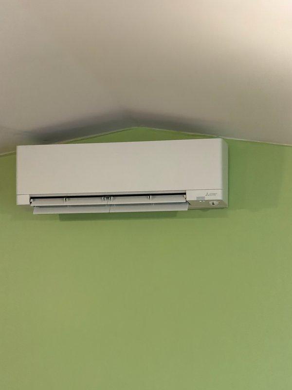 Responded to service call for Mitsubishi Electric mini-split system in garage with inadequate cooling performance. Upon inspection, discovered system was completely flat on refrigerant charge. Recharged system to manufacturer specifications under warranty coverage. Verified proper cooling operation of both indoor wall-mounted evaporator unit and outdoor condenser unit before completing service.