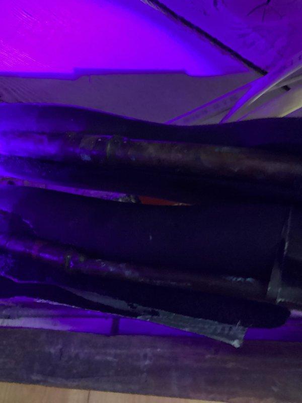 Performed return visit to mini split system for leak detection following dye injection from previous service call. Conducted thorough leak search of system components in attic space using UV light inspection but was unable to locate source of refrigerant loss. System age was noted as a contributing factor, and replacement options were discussed as the most viable long-term solution given the inability to identify the leak location.