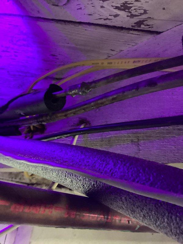Performed return visit to mini split system for leak detection following dye injection from previous service call. Conducted thorough leak search of system components in attic space using UV light inspection but was unable to locate source of refrigerant loss. System age was noted as a contributing factor, and replacement options were discussed as the most viable long-term solution given the inability to identify the leak location.