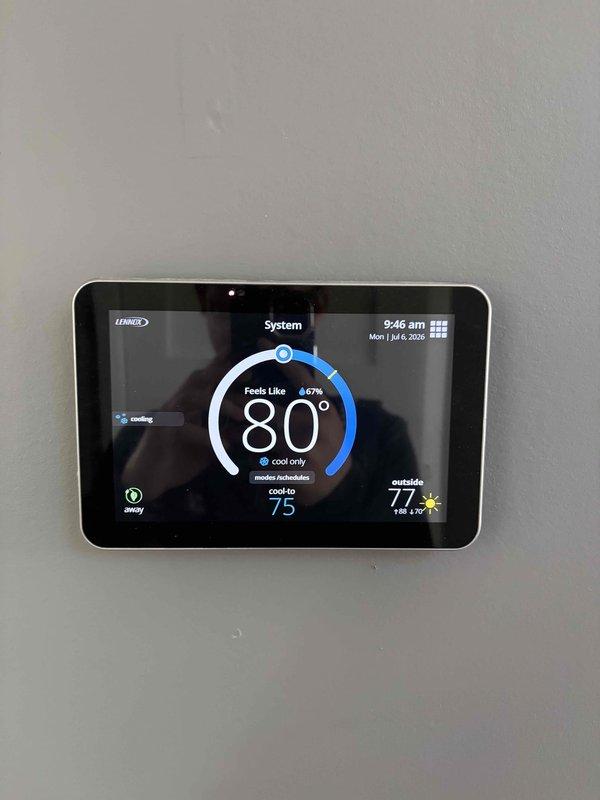 Responded to no cooling complaint on 7-year-old system. Verified thermostat operating correctly and found compressor running but outdoor fan motor not operating. Tested low voltage (24V) and high voltage (240V) circuits, both within normal parameters. Tested dual-run capacitor (40+5 MFD), confirmed functioning properly. Diagnosed failed condenser fan motor as root cause of no cooling condition. Submitted parts order and warranty verification request given system age, and scheduled return visit for fan motor replacement upon parts arrival.