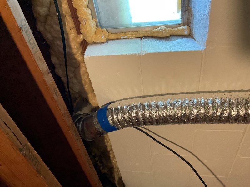 Responded to service call regarding water heater venting concerns and carbon monoxide alarm activation. Upon inspection, observed condensate accumulation at B-vent cap connected to atmospheric natural-draft water heater. Identified orphaned vent/chimney condition resulting from previous furnace upgrade from 80% efficiency to 96% high-efficiency unit, leaving water heater as sole appliance venting through oversized chimney. This configuration allows flue gases to cool prematurely, causing condensation and potential backdrafting at draft hood, particularly under negative pressure conditions. Documented moisture presence in venting system and confirmed prior spillage events reported by occupant. Performed preliminary visual inspection of venting components and HVAC system with air conditioning operating and building closed. Photographed ductwork installation and system configuration for documentation. Recommended comprehensive follow-up visit to conduct combustion appliance zone depressur