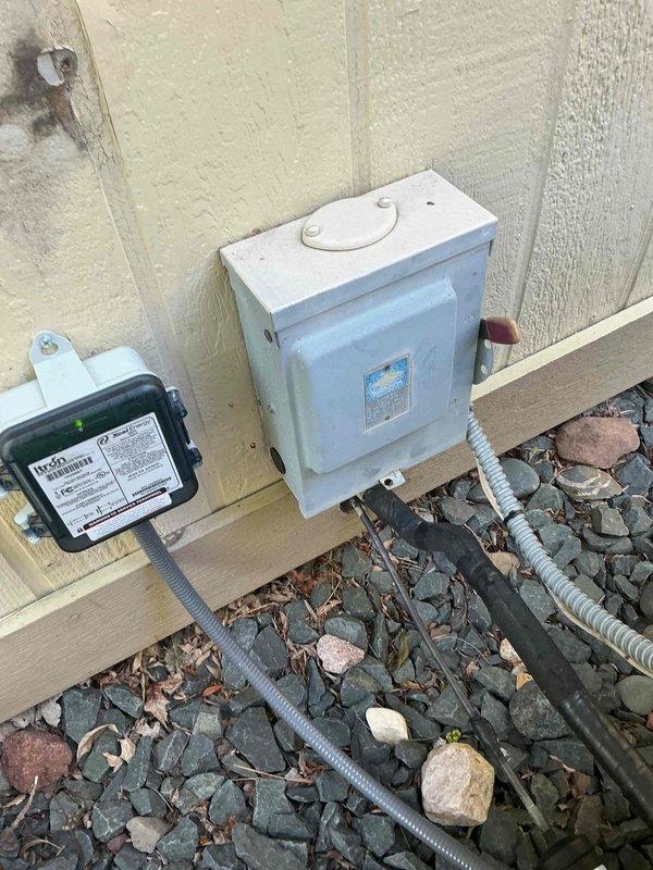 Responded to no cooling complaint on 22-year-old Carrier air conditioning system. Upon arrival, discovered system was completely depleted of refrigerant. Customer reported unit was functioning properly two days prior, indicating a sudden catastrophic leak. Performed thorough inspection of all accessible components including braze joints, service valves, and coil areas. No oil spray or residue found at joints or valves, suggesting leak source is internal to either evaporator or condenser coil. Noted significant debris accumulation in outdoor unit consisting of leaves and organic matter around coil assembly, which may contribute to reduced airflow and system efficiency. 

At customer request, conducted additional evaluation of furnace and heat exchanger to determine viability of complete system replacement versus repair. Visual inspection of heat exchanger revealed potential crack formation beginning in one of the eyelets; however, findings were not definitive enough to warrant immediate