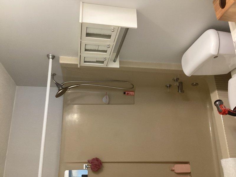 Responded to emergency call for water leak above basement shower with drop ceiling access. Upon inspection, identified active leak in overhead plumbing and discovered cracked bathtub as source of water damage. Documented conditions with photos and provided detailed estimate for complete shower replacement to address both the compromised tub and associated plumbing issues.