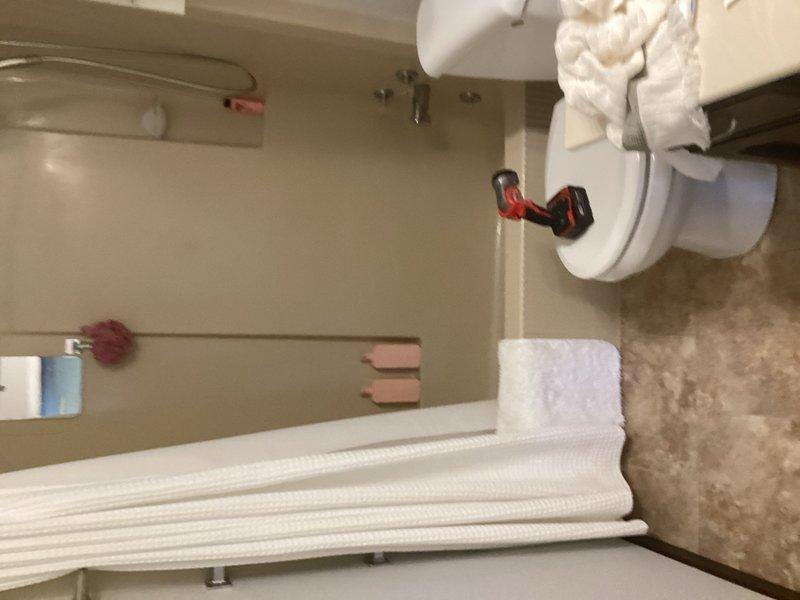 Responded to emergency call for water leak above basement shower with drop ceiling access. Upon inspection, identified active leak in overhead plumbing and discovered cracked bathtub as source of water damage. Documented conditions with photos and provided detailed estimate for complete shower replacement to address both the compromised tub and associated plumbing issues.