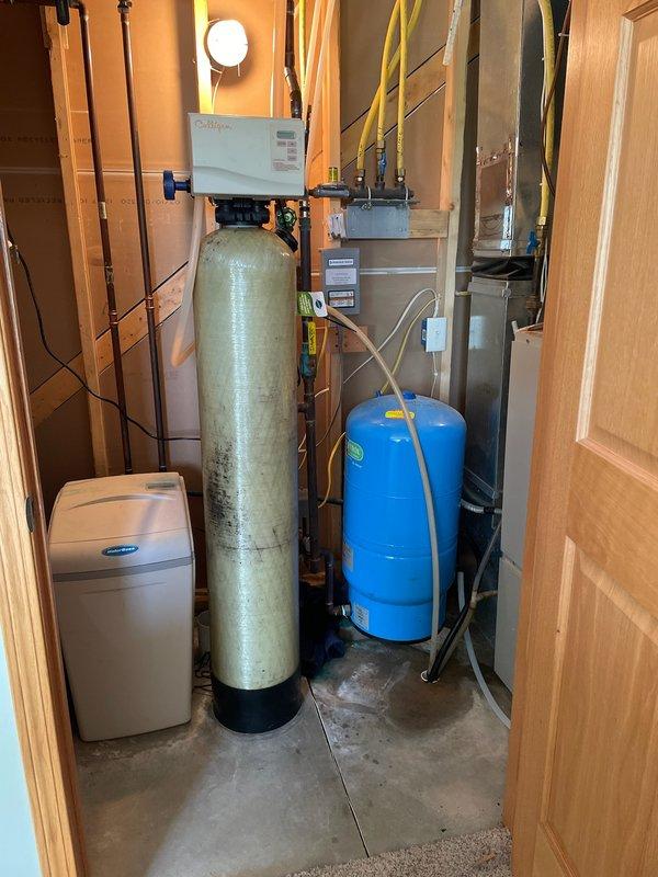 Responded to emergency no-water situation caused by leak at well tank pressure system. Upon arrival, identified active leak in copper piping at pressure tank fittings in mechanical room. System assessed and determined two fittings required replacement to restore water service. Customer declined water mitigation assistance for affected areas. Provided estimate for fitting repairs to resolve leak and restore full water pressure to residence.