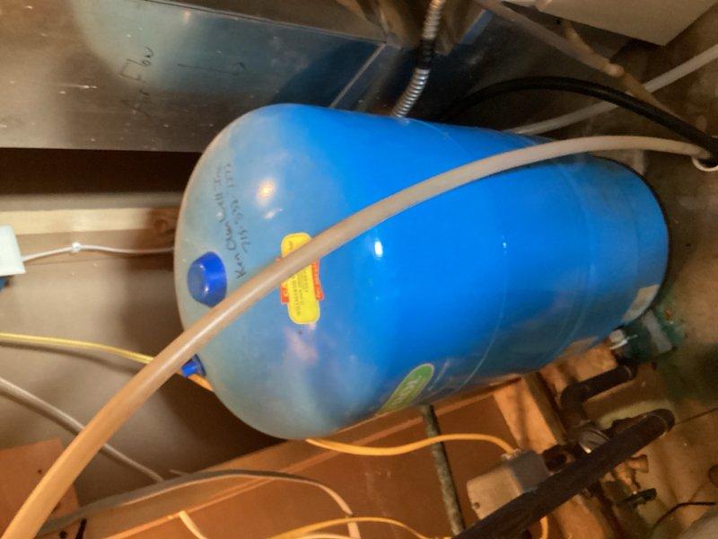 Responded to emergency no-water situation caused by leak at well tank pressure system. Upon arrival, identified active leak in copper piping at pressure tank fittings in mechanical room. System assessed and determined two fittings required replacement to restore water service. Customer declined water mitigation assistance for affected areas. Provided estimate for fitting repairs to resolve leak and restore full water pressure to residence.