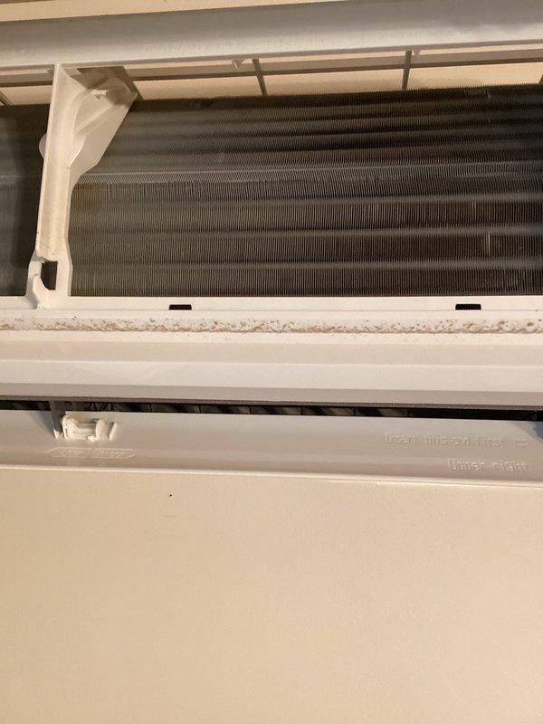 Responded to no cooling call on mini split system. Upon arrival, unit was blowing warm air from indoor head unit. Performed system diagnostics and discovered low refrigerant charge. Inspected outdoor unit connections and observed aged brass fittings with corrosion and patina buildup on refrigerant lines, indicating potential leak points. Indoor evaporator coil showed dust accumulation but no visible damage. Confirmed system was operating with insufficient refrigerant levels causing loss of cooling capacity. Discussed repair options with customer including leak detection, repair of refrigerant leak, system recharge, and potential replacement considerations given age and condition of equipment.