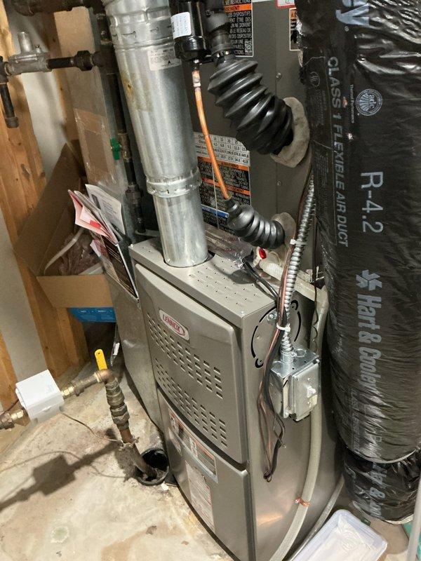 Completed follow-up calibration service on recently installed Lennox furnace and air conditioning system. Performed system diagnostics and temperature verification using digital measuring instruments, confirming proper refrigerant line temperatures and airflow. Verified all HVAC components operating within manufacturer specifications, including heat pump unit, ductwork connections, and ventilation system. System calibration successful with all equipment functioning properly.