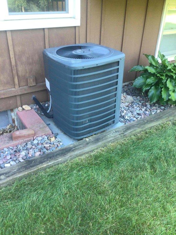 Completed air conditioning tune-up on outdoor condensing unit. During inspection, found the capacitor reading out of specification and replaced it with a new unit. Performed coil cleaning, washed the exterior unit, and verified proper system operation upon completion.