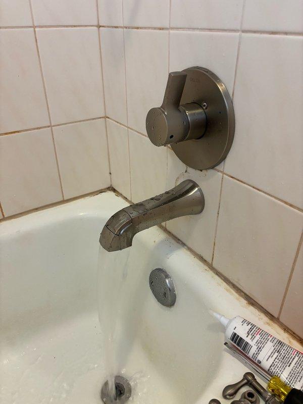 Replaced upstairs tub and shower valve assembly and trim in bathroom. Installed two 1/2-inch ball valve isolation valves on both hot and cold water lines within the access panel for future service accessibility. Removed existing valve, installed new tub and shower valve with corresponding trim kit, and verified all connections were secure. Restored water supply, performed leak test on all connections and fittings with no leaks detected. Left fixture fully operational and cleaned work area.