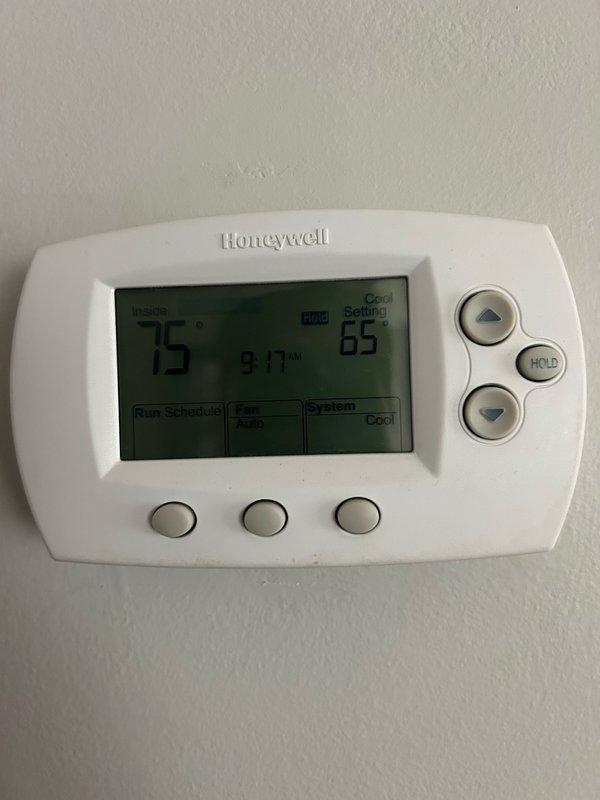 Performed comprehensive AC tune-up on rooftop Bryant air handler system after coordinating roof access with front desk. Conducted full maintenance inspection including thermostat operation verification (Honeywell digital unit displaying proper temperature readings), filter condition assessment, blower assembly examination, outdoor coil inspection, electrical component testing, contactor and capacitor evaluation, condensate drain check, refrigerant performance analysis, and temperature split measurements. All system readings confirmed within normal operating parameters with no mechanical defects or safety concerns identified. System operating properly at this time. Advised on importance of regular filter changes, maintaining clean indoor and outdoor coils, and scheduling routine preventive maintenance to ensure continued optimal performance and prevent future issues.