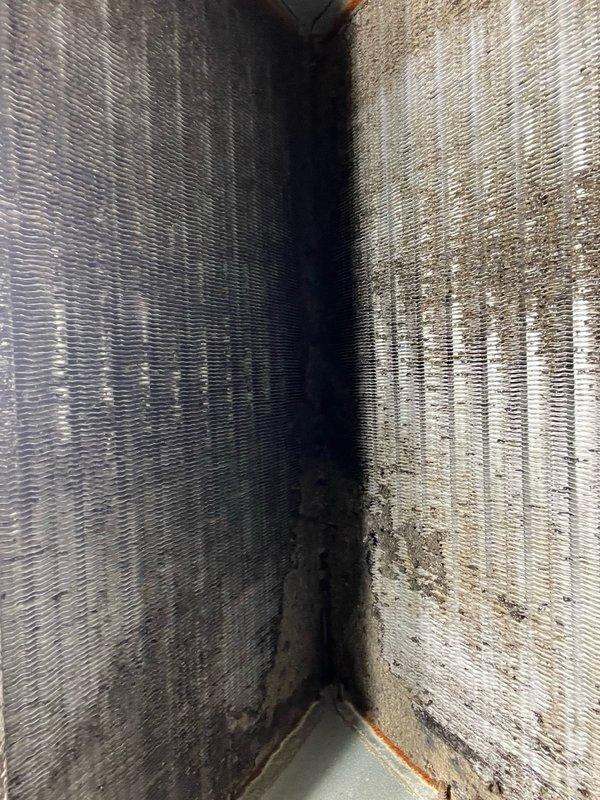 Performed evaporator coil cleaning on residential air conditioning system. Upon arrival, found heavy accumulation of dust, debris, and biological growth throughout the coil assembly, significantly restricting airflow. Manually brushed substantial debris from the bottom side of the coil fins and flushed thoroughly with water until drainage ran clear. Additionally, installed sheet metal patch to repair hole in ductwork. After cleaning, tested system operation and confirmed significantly improved airflow and proper drainage, restoring unit to optimal performance.