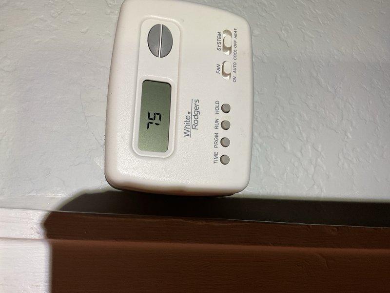Responded to no-cool call and discovered significant water accumulation on basement floor, inside blower compartment, and on top of heat exchanger. System consists of circa 1982 York R-22 condensing unit paired with 2018 Lennox furnace. Upon inspection, found PVC condensate drain line partially restricted with debris causing inadequate drainage. Observed evidence suggesting evaporator coil had partially frozen, resulting in condensate overflow when ice melted. 

Evaluated system operating conditions with 85°F outdoor ambient temperature and measured static pressure at approximately 112 psig, confirming abnormal performance parameters. Water intrusion had affected blower compartment and was dripping onto aluminized steel heat exchanger, creating potential for secondary damage. While condensate line was still attempting to drain, restriction was sufficient to cause backup during normal operation.

Given the 40+ year age of the condensing unit, obsolete R-22 refrigerant requirement, and c