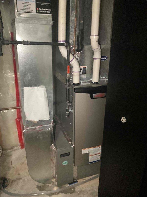 Performed comprehensive AC tune-up on Lennox system in response to concerns about uneven cooling on upper level and request for airflow and refrigerant verification. Upon inspection, found system completely empty of refrigerant. Due to age of equipment and cost-effectiveness analysis, recommended and completed full system replacement with new Carrier unit, including proper refrigerant charging, venting installation with PVC piping, gas line connection with safety shutoff valve, and electrical wiring. New installation tested and verified operational with proper airflow distribution throughout home.