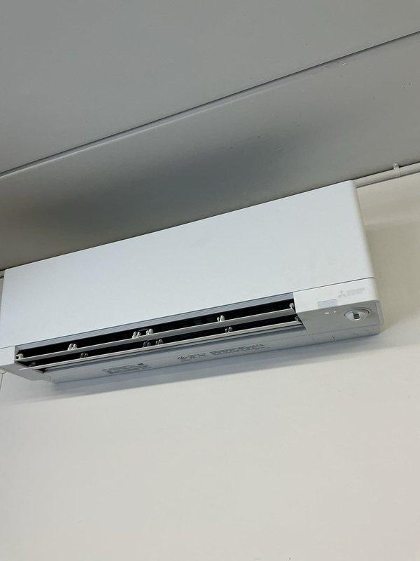 Responded to service call for one-year-old mini split system reported as not cooling or turning on. Upon arrival, found remote control set to auto mode instead of cooling mode. Switched remote to cool mode and verified refrigerant charge levels were within manufacturer specifications. Confirmed unit powered on properly and tested cooling operation. System now running and cooling as designed with no further issues identified.