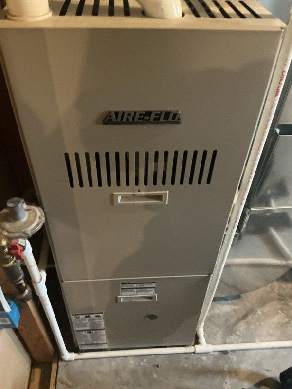 Responded to no cooling complaint on 16-year-old residential air conditioning system. Upon arrival, found outdoor condenser unit operational but refrigerant line set severely kinked, restricting flow by approximately 75%. System showed reduced temperature split of 10 degrees across evaporator coil, and previous water leakage at furnace had occurred but was dry at time of inspection. Discussed repair versus replacement options with homeowner, who elected to proceed with full system replacement due to age of equipment and extent of refrigerant line damage.