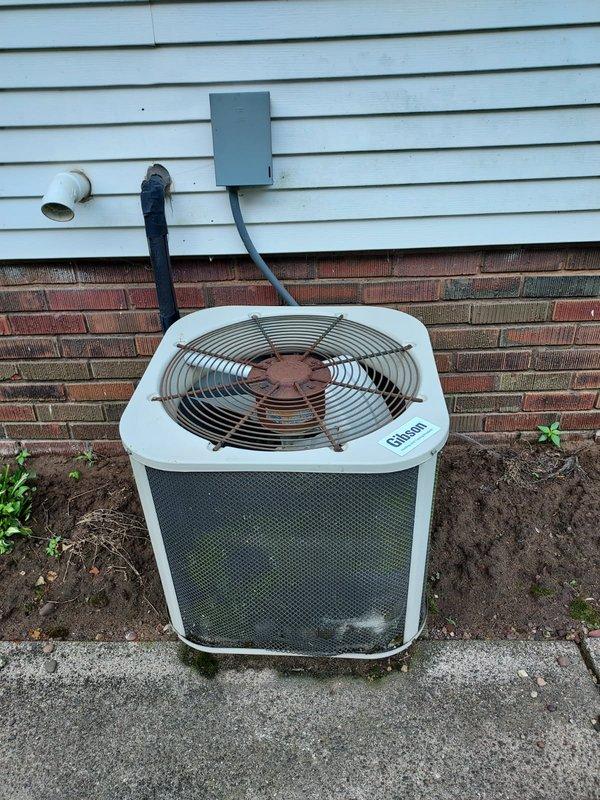 Responded to no cooling complaint on Gibson condensing unit at residential property. Upon arrival, discovered no high voltage power to outdoor condenser. Found circuit breaker in off position and attempted to restore power by resetting breaker multiple times, but unit failed to receive power. Confirmed electrical fault preventing power delivery to condensing unit. Left disconnect switch in off position for safety until electrical issues can be resolved. Coordinated with electrician for follow-up service to diagnose breaker failure and evaluate existing knob and tube wiring that requires replacement. Unit remains non-operational pending electrical repairs to restore proper power supply to condensing unit.