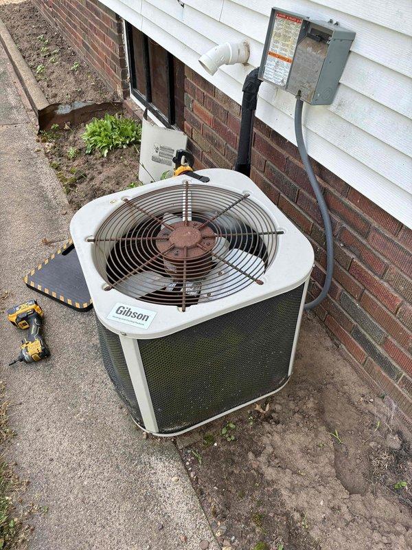 Responded to no cooling complaint on Gibson condensing unit at residential property. Upon arrival, discovered no high voltage power to outdoor condenser. Found circuit breaker in off position and attempted to restore power by resetting breaker multiple times, but unit failed to receive power. Confirmed electrical fault preventing power delivery to condensing unit. Left disconnect switch in off position for safety until electrical issues can be resolved. Coordinated with electrician for follow-up service to diagnose breaker failure and evaluate existing knob and tube wiring that requires replacement. Unit remains non-operational pending electrical repairs to restore proper power supply to condensing unit.