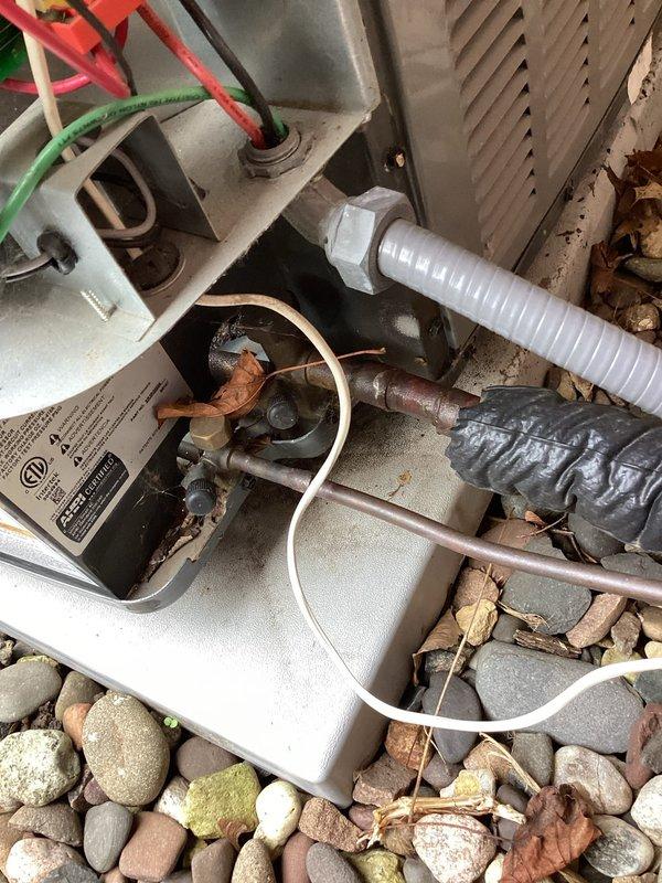 Responded to no-cooling complaint on 2-year-old Goodman air conditioning system that would not restart after cycling off. Upon arrival, found thermostat set to 66 degrees with system not running and no error codes displayed. Performed diagnostic testing including amp draw measurements on compressor, verified capacitor functionality, and inspected control board and electrical connections. All electrical components tested within normal operating parameters with no mechanical or electrical failures identified. Determined system was likely experiencing thermal overload protection lockout due to excessive runtime attempting to maintain unrealistic setpoint during high ambient temperature conditions. Advised proper thermostat settings around 70 degrees to prevent system from overworking and cycling on thermal protection, which would explain intermittent operation requiring breaker resets to restore functionality.