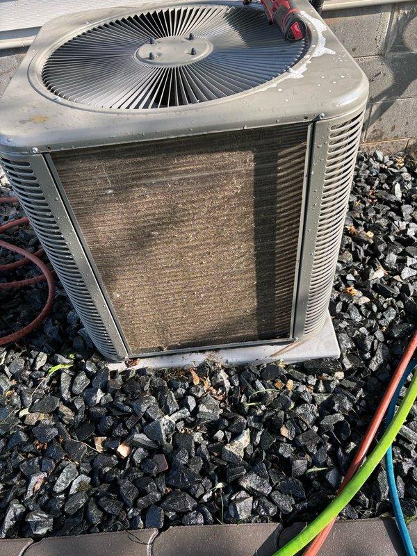 Responded to warranty service call for water leakage at base of furnace installed less than one year ago. Upon inspection, determined that water accumulation and increased system noise were caused by severely restricted airflow due to a fully blocked outdoor condenser coil and dirty air filter. 

Performed complete system evaluation including cleaning of outdoor condenser coil, inspection of evaporator coil confirming no leaks or icing present, and verification of proper refrigerant charge with 21°F temperature split across the system. Confirmed condensate drain line was free flowing and clear of obstructions.

Replaced dirty 5" MERV 16 air filter with new filter, resulting in immediate improvement in system noise levels and airflow. Inspected Aprilaire humidifier and noted heavy mineral deposits on pad, indicating need for more frequent maintenance. Provided homeowner instruction on proper humidifier pad replacement procedure for Aprilaire #35 model.

Established maintenance schedule 