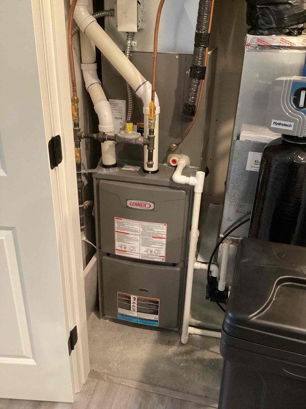Completed water heater flush with no issues identified. Inspected water treatment system including dual filtration tanks and water softener unit, all equipment found to be in good working condition. Plumbing system is relatively new with proper installation observed throughout mechanical room.