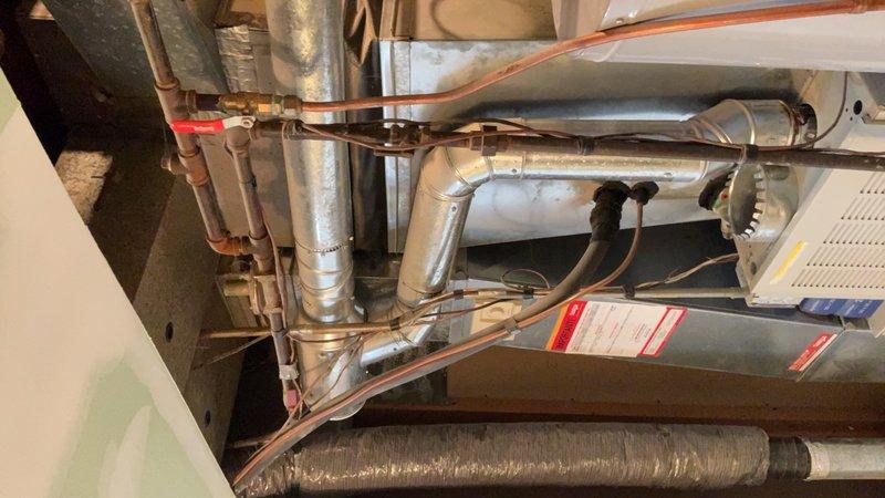 Responded to service call for leaking 40-gallon natural gas water heater with standard vent configuration. Upon inspection, confirmed active leak that worsens significantly during high hot water demand periods. Unit remains operational but requires replacement to prevent potential water damage and ensure reliable hot water delivery. Documented existing installation including copper supply lines, pressure relief valve configuration, and venting system. Provided estimate for complete water heater replacement with new 40-gallon natural gas unit and standard atmospheric venting.