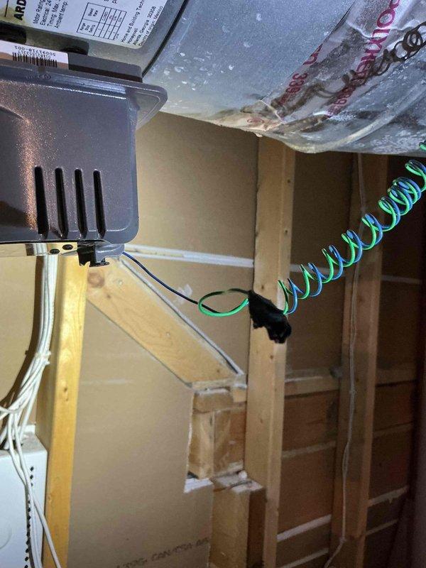 Responded to callback for no cooling condition with ice formation on refrigerant lines. Upon inspection, confirmed frozen evaporator coil in attic air handler and diagnosed improper zone system operation preventing adequate airflow across the coil. Documented equipment conditions and zone control panel configuration with photos. Advised customer that estimates for necessary zone system repairs will be provided to resolve the airflow restriction issues causing the freeze-up condition.