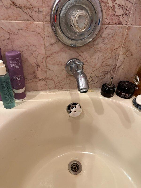 Responded to bathtub overflow leak in main bathroom. Upon inspection, found the overflow assembly was loose and causing water seepage. Tightened the overflow assembly and performed leak test by running water over the overflow—no leaks detected. Installed new overflow cover to replace the old unit. Additionally, inspected three lavatory faucets on the main floor. Identified that one lavatory faucet requires cartridge replacement and another needs silicone reapplication around the pop-up drain assembly. Completed leak testing on all inspected fixtures and left operational faucets in service.