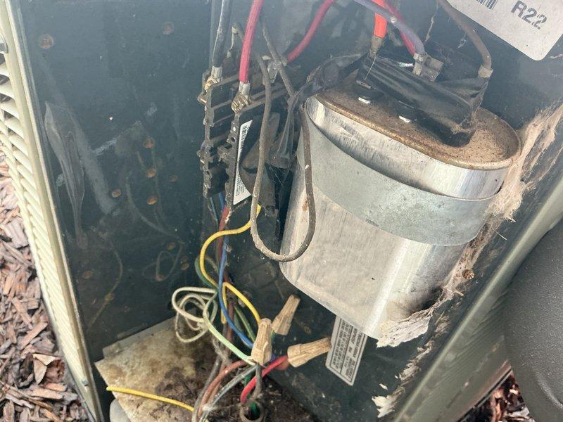 Responded to no cooling complaint on 22-year-old R22 air conditioning system. Upon inspection, found failed capacitor with evidence of previous replacement. Replaced capacitor and tested system operation. Post-repair diagnostics revealed compressor drawing excessive amperage beyond maximum rated specifications and high-side refrigerant pressure exceeding 250 psi (normal range 150-180 psi), indicating compressor failure and system restriction. Advised customer that capacitor replacement is temporary measure without guarantee due to underlying compressor failure. Explained risk of indoor coil freezing and potential water damage to furnace. System contains obsolete R22 refrigerant. Recommended complete system replacement and scheduled estimate appointment.