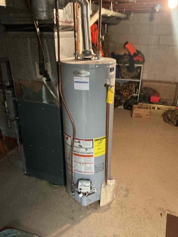 Completed appliance hookup and connection in basement utility area ahead of scheduled health inspection. Delivered water supply line spool and installed compression fitting on water supply connection. Assessed drain line configuration and determined proper elbow joint installation to correct improper drainage setup, ensuring all plumbing connections meet code requirements for final inspection approval.