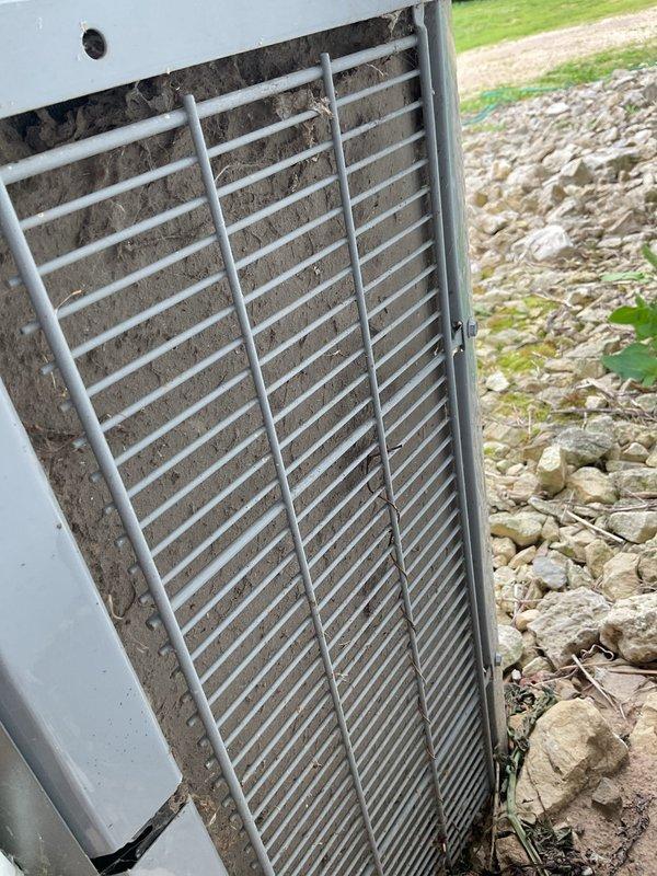 Performed preventative maintenance tune-up on residential air conditioning system. Upon arrival, found outdoor condenser unit heavily obstructed with dirt, dust, and debris accumulation throughout the coil fins and grille, significantly restricting airflow. Conducted thorough coil cleaning and system wash-down to restore proper ventilation. Initial testing showed 16° temperature drop across the evaporator coil. Post-cleaning diagnostics revealed borderline low refrigerant charge with superheat readings measuring 14-15°, indicating system is not operating at optimal efficiency. Advised customer of potential refrigerant deficiency and recommended monitoring system performance to determine if refrigerant charge adjustment will be necessary for peak operation.