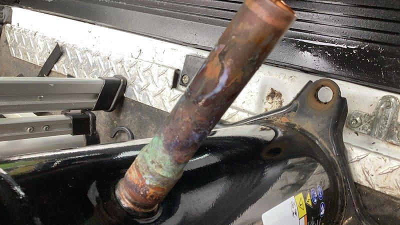Responded to callback for newly installed HVAC unit experiencing water leakage. Upon inspection, identified failed condensate drain line with severe corrosion and oxidation throughout the copper piping. Replaced defective condensate line and verified proper drainage function, resolving the leak issue.