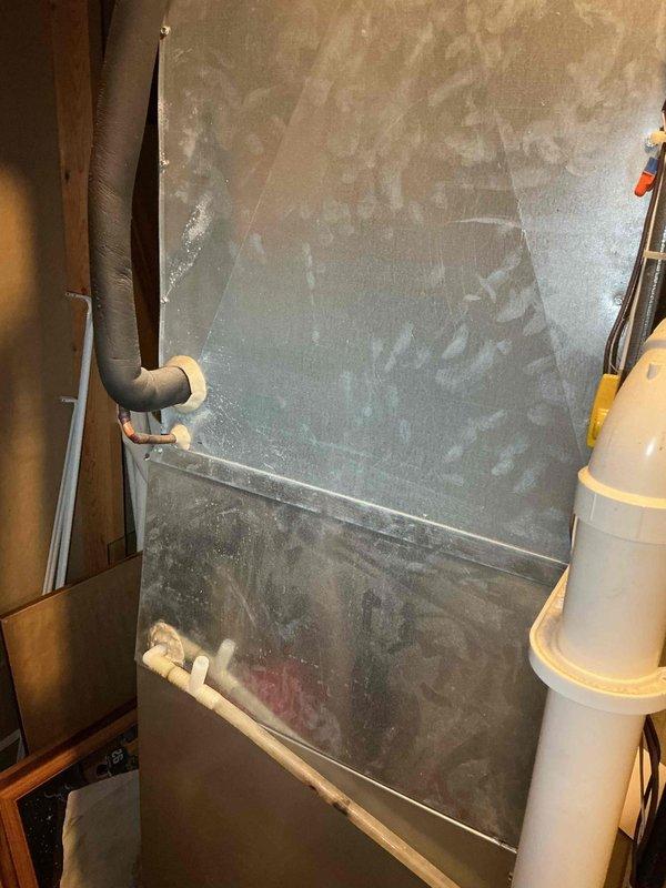 Completed comprehensive tune-up service on residential heating and cooling system. Performed thorough cleaning and testing of air conditioning unit, verifying proper operation of all components. Conducted detailed inspection of furnace system, during which a compromised secondary heat exchanger was identified. Documented findings with photos showing lockout tag applied to equipment and overall system condition. Discussed repair options with homeowner, who requested pricing information for necessary repairs to address the heat exchanger issue.
